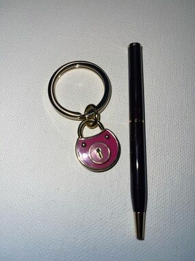 Coach Pink Padlock Keychain with Gold Hardware and Black Coach Pen